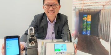 ASTRI’s Ricky Leung with the Next Generation Cold Food Import Safety Management Platform, which enables users to control the electronic lock (middle) through the mobile app (left). Truck drivers can make use of the tablet (right) to access information, such as temperature and location of the container, in real time.