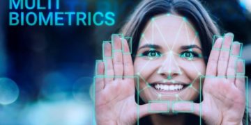 Close up of smiling girl making frame with hands around her face