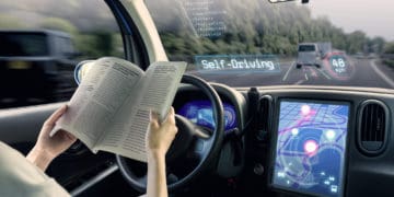 cockpit of autonomous car. a vehicle running self driving mode and a woman driver reading book.