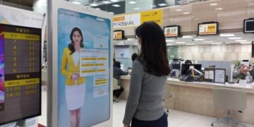 Image of an AI Banker in a Kiosk installed in KB Kookmin Bank Donam-dong Branch.