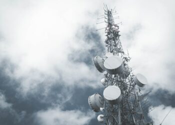 Photo by Aaditya Hirachan: https://www.pexels.com/photo/microwave-antennas-hanging-on-a-communication-tower-10259517/