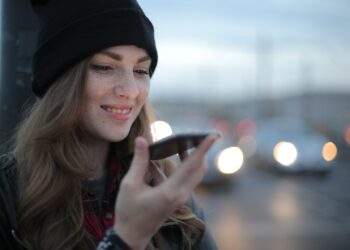 Photo by Andrea Piacquadio: https://www.pexels.com/photo/joyful-young-woman-phoning-on-street-in-evening-3776659/