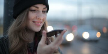 Photo by Andrea Piacquadio: https://www.pexels.com/photo/joyful-young-woman-phoning-on-street-in-evening-3776659/