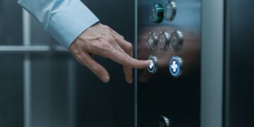 Photo by cottonbro studio: https://www.pexels.com/photo/close-up-shot-of-a-hand-pressing-an-elevator-button-8453040/