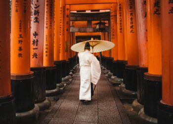 Photo by DSD: https://www.pexels.com/photo/man-holding-an-umbrella-1822605/