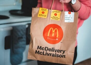 Photo by Erik Mclean: https://www.pexels.com/photo/man-holding-a-mcdonald-s-paper-bag-4111069/