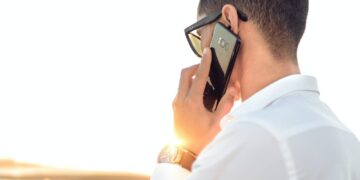 Photo by Hassan OUAJBIR: https://www.pexels.com/photo/shallow-focus-photography-of-a-man-in-white-collared-dress-shirt-talking-to-the-phone-using-black-android-smartphone-804065/