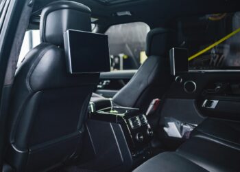 Photo by jay pizzle: https://www.pexels.com/photo/modern-car-interior-with-entertainment-system-and-monitors-on-seats-4150596/