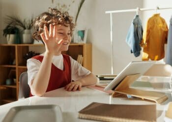 Photo by Julia M Cameron: https://www.pexels.com/photo/photo-of-child-smiling-while-using-tablet-computer-4145032/