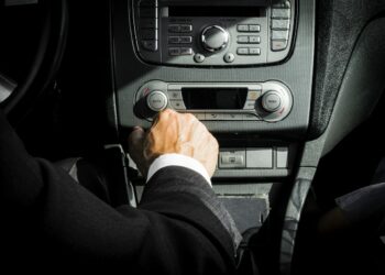 Photo by Mateusz Dach: https://www.pexels.com/photo/man-in-black-suit-inside-car-1135379/