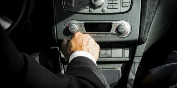 Photo by Mateusz Dach: https://www.pexels.com/photo/man-in-black-suit-inside-car-1135379/