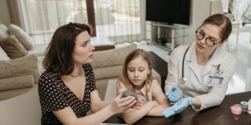 Photo by Pavel Danilyuk: https://www.pexels.com/photo/mother-and-doctor-having-a-conversation-while-holding-gray-device-7653310/